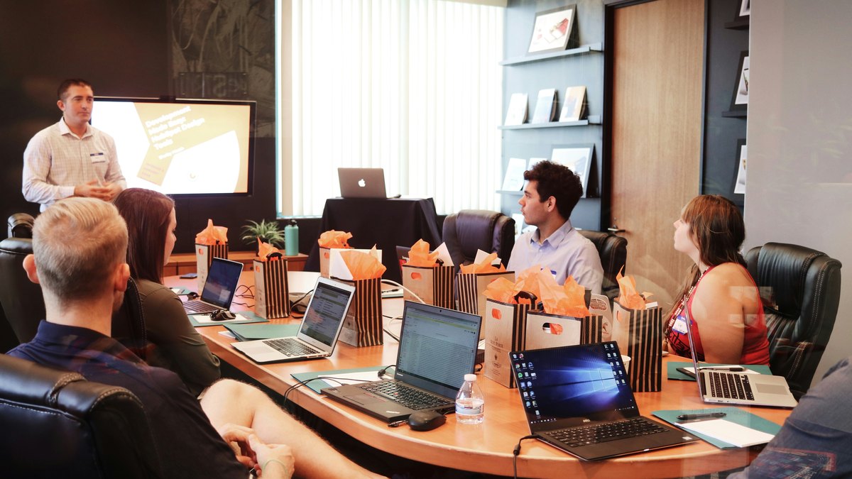 Franchisor leadership team in a working session around a boardroom table